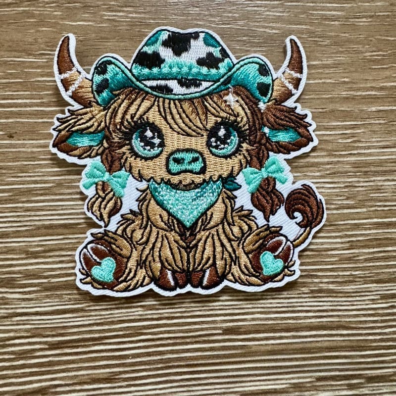 On A Whim Hats Aqua Cowgirl Highland Cow  Iron-On Patch