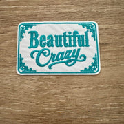 On A Whim Hats Beautiful Crazy - White Embroidered Iron-On Patch