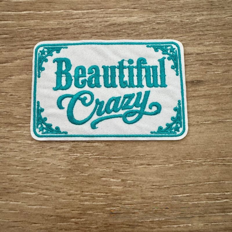 On A Whim Hats Beautiful Crazy - White Embroidered Iron-On Patch