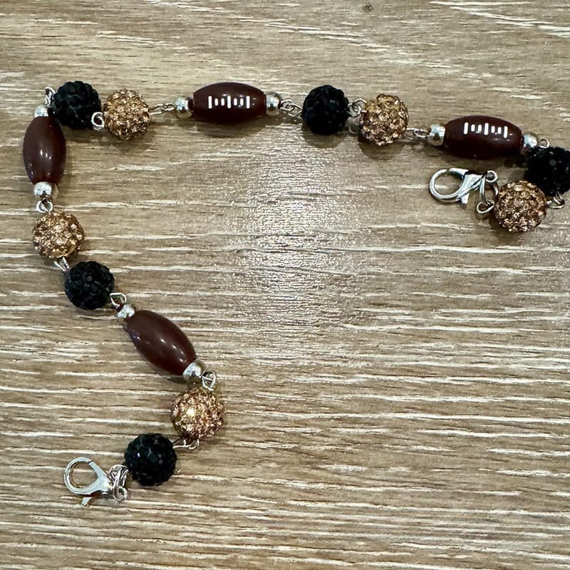 On A Whim Hats Black and Gold Sparkly Football Hat Chain