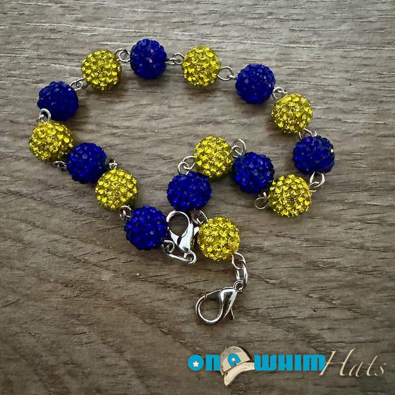 On A Whim Hats Blue and Yellow Sparkly Hat Chain