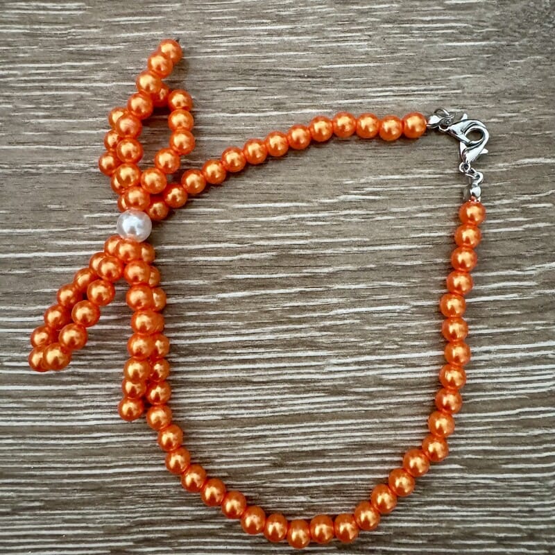 On A Whim Hats Orange Pearl Bow Beaded Bracelet