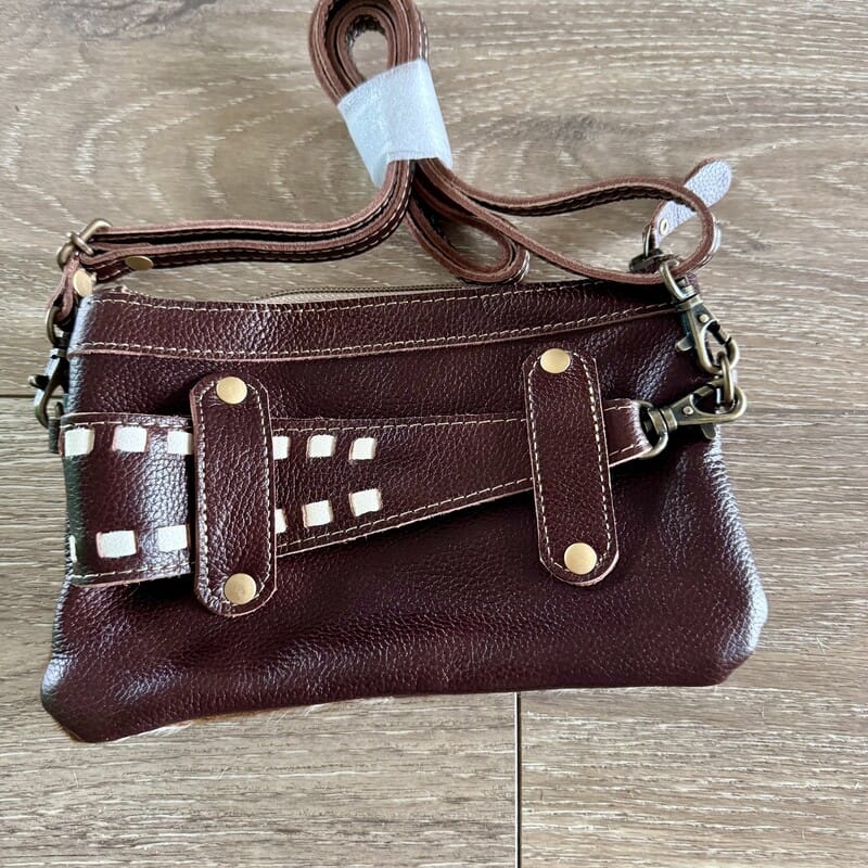 Darlin' cowhide Western handbag with adjustable leather strap, worn crossbody or as a belt bag