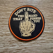 On A Whim Hats Don't Bite The Hand Iron-On Patch