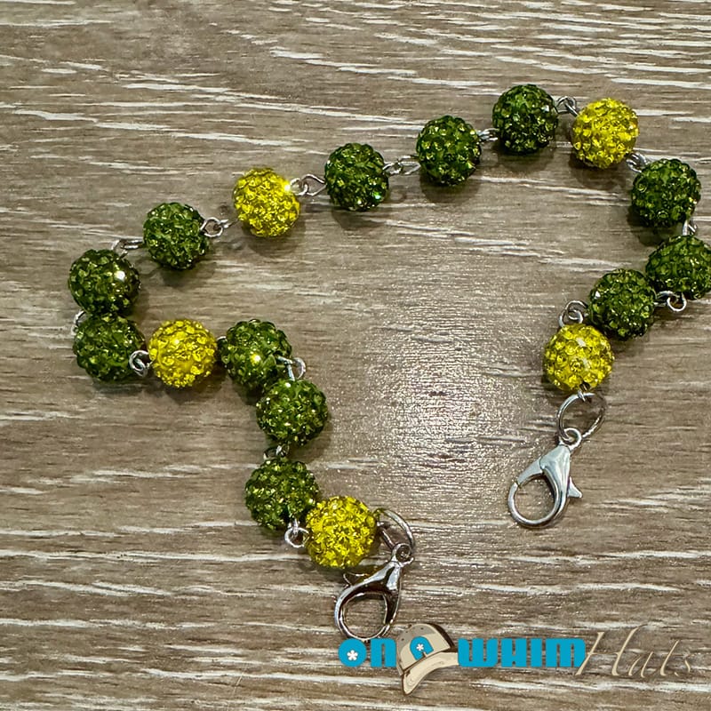 On A Whim Hats Green and Yellow Sparkly Hat Chain