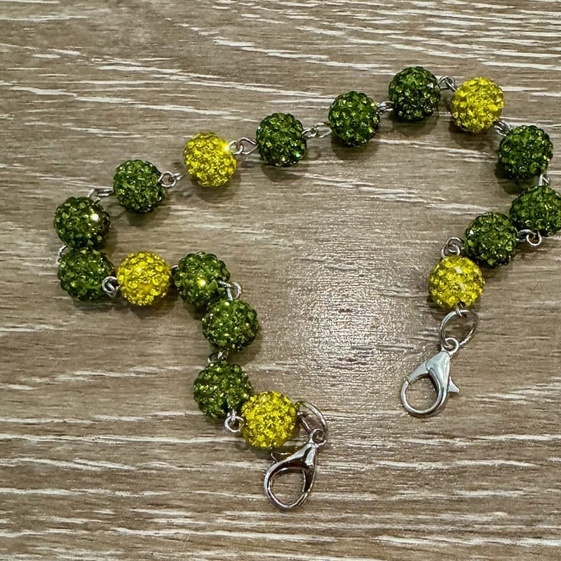 On A Whim Hats Green and Yellow Sparkly Hat Chain
