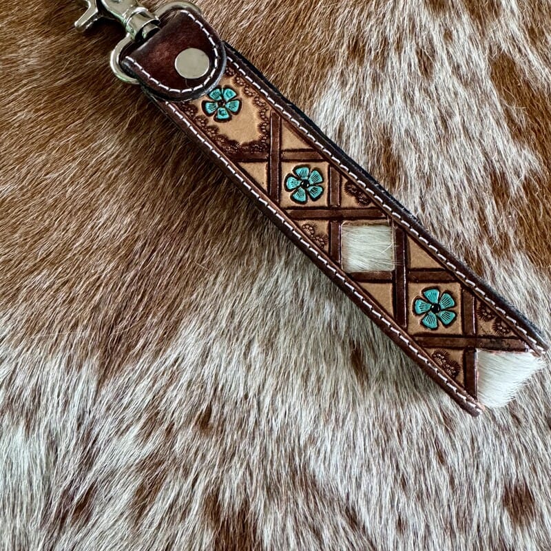 Hand-tooled flower cowhide key fob, Western leather keychain detail
