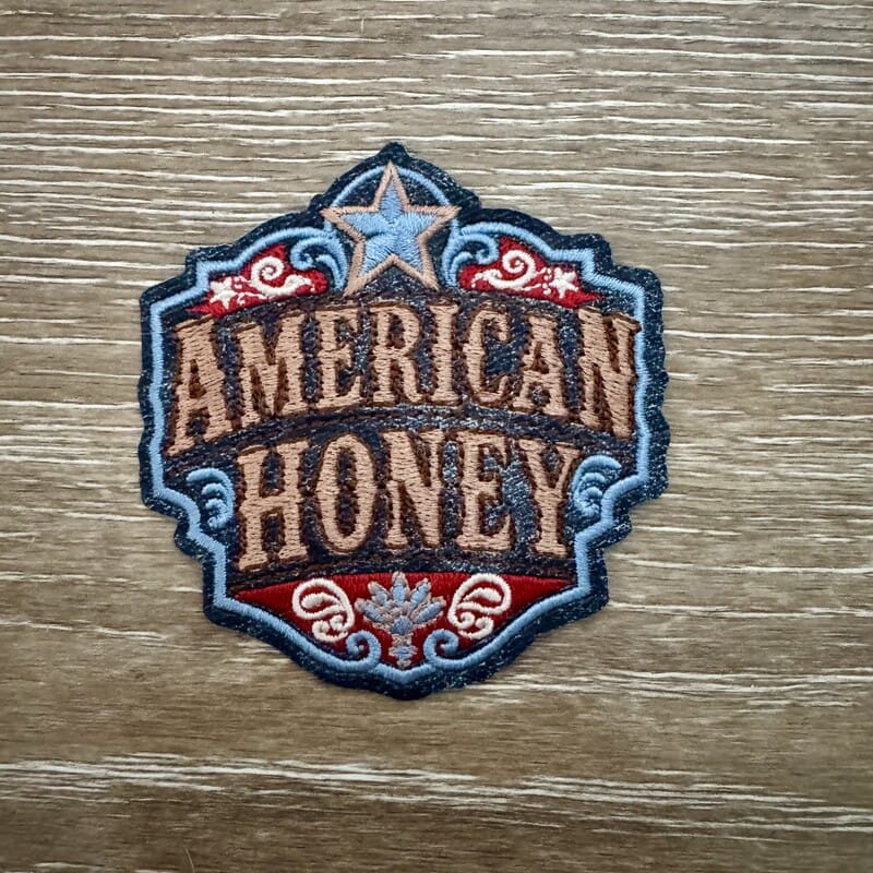 American Honey badge crest iron-on patch in tan and red