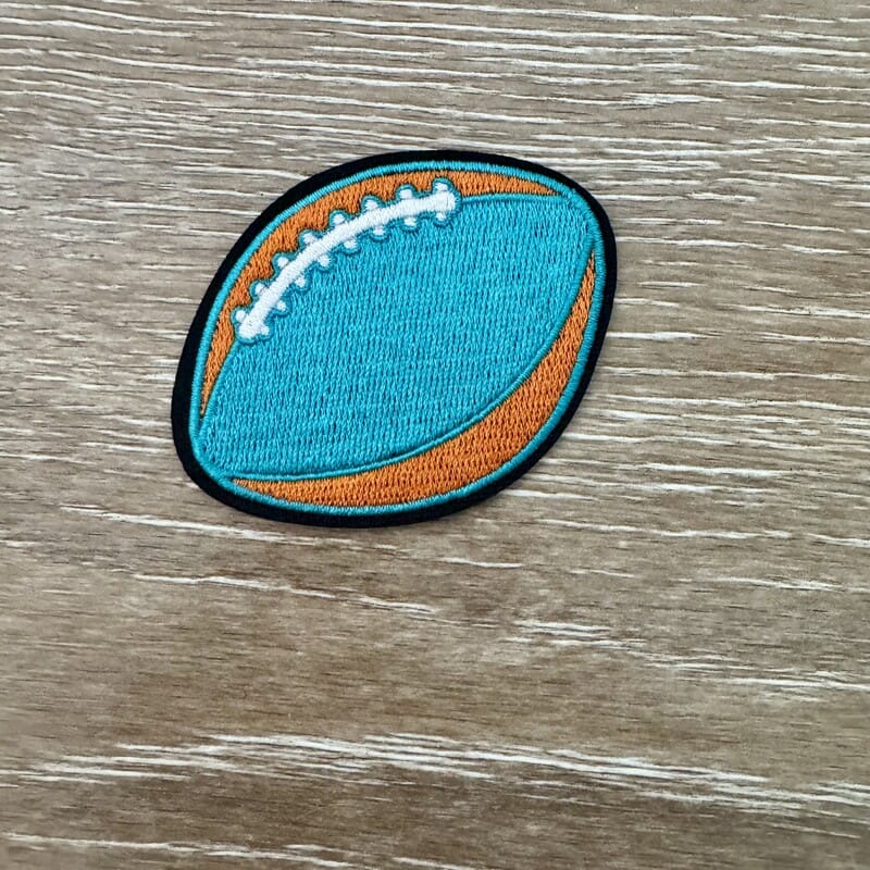 On A Whim Hats Aqua and Orange Football Iron-On Patch