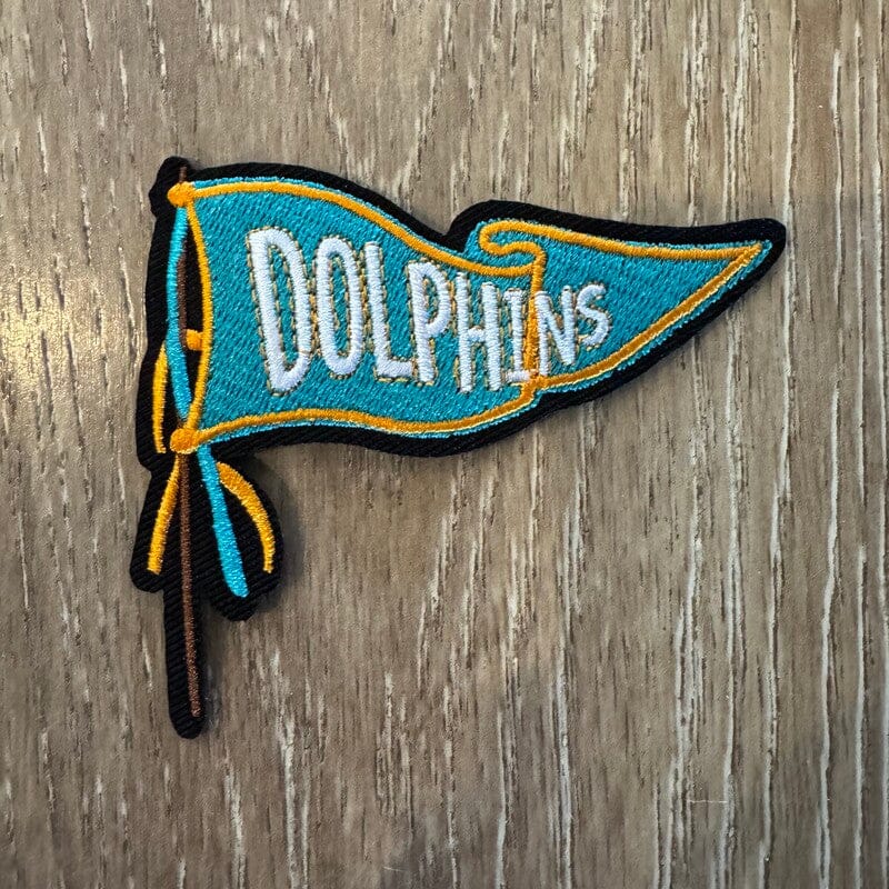 On A Whim Hats Aqua and Orange Pennant Iron-On Patch - Black Trim