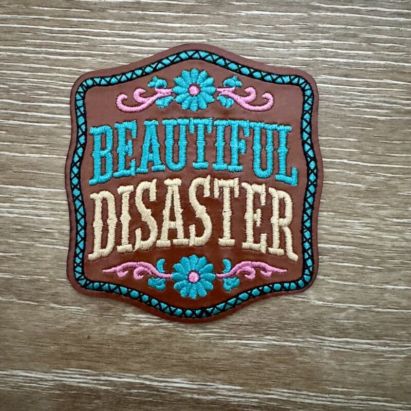 Beautiful Disaster floral badge iron-on patch with turquoise flowers