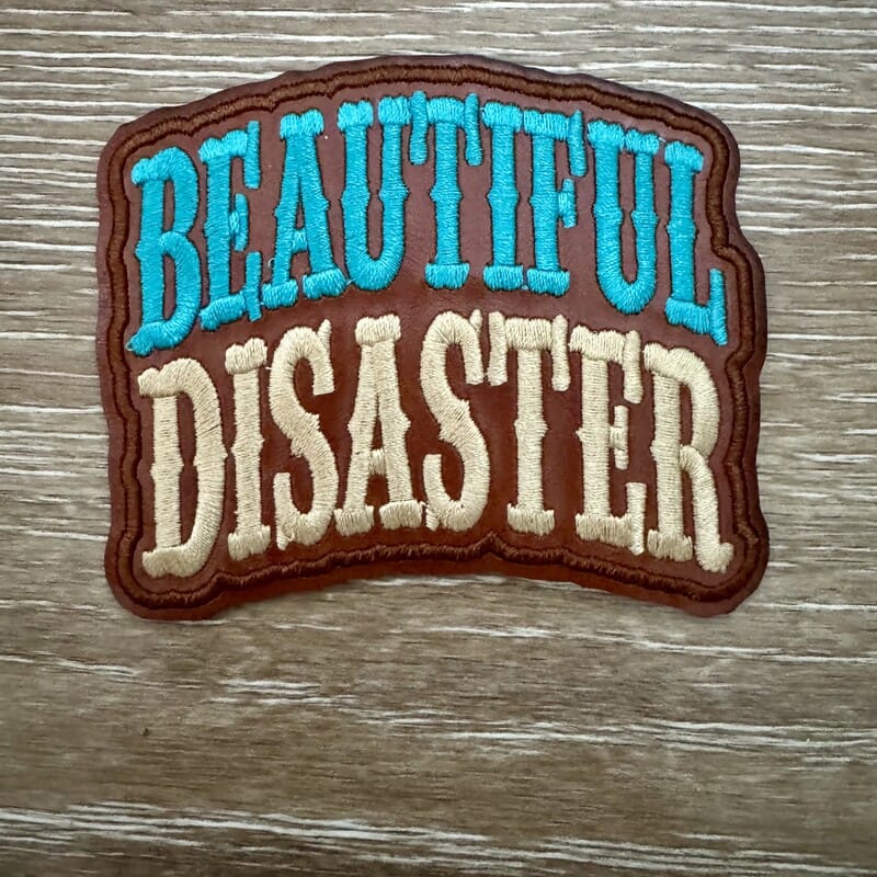 Beautiful Disaster western scroll iron-on patch in teal and cream