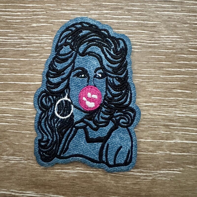 Denim-tone big hair silhouette iron-on patch blowing bubblegum