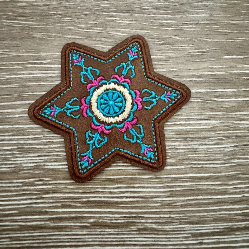 Boho mandala star iron-on patch with turquoise medallion in brown six-point star