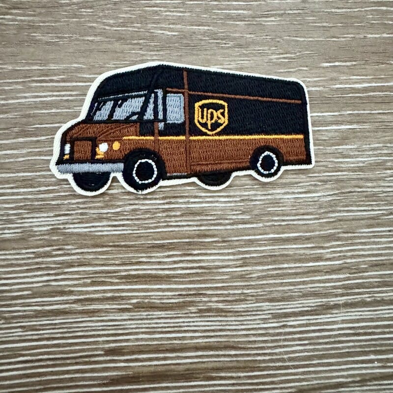 Brown delivery truck embroidered iron-on patch with detailed package truck design