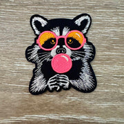 On A Whim Hats Bubblegum Raccoon Iron-On Patch
