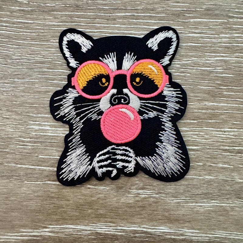 On A Whim Hats Bubblegum Raccoon Iron-On Patch