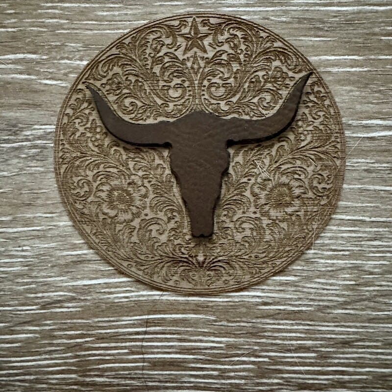 Dark chocolate longhorn skull on engraved western floral medallion iron-on patch for hats by On A Whim Hats
