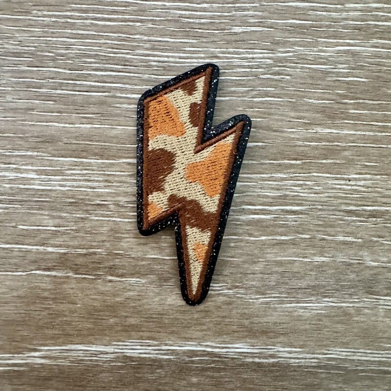 On A Whim Hats Cow Print Lightning Bolt Iron-On Patch