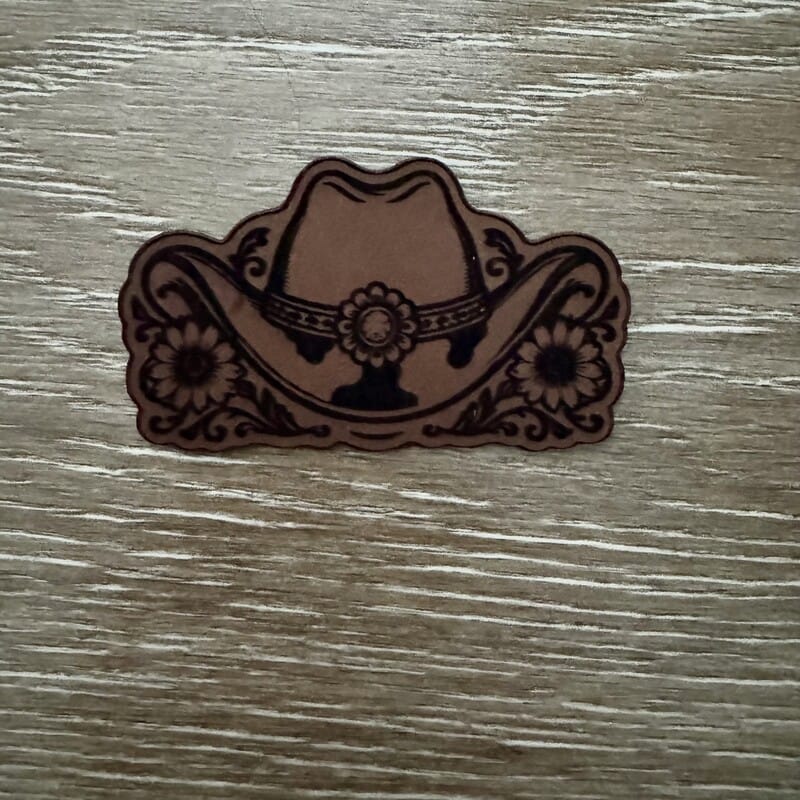 Cowboy hat and sunflowers laser-engraved leather-look iron-on patch with concho band and floral scrollwork by On A Whim Hats