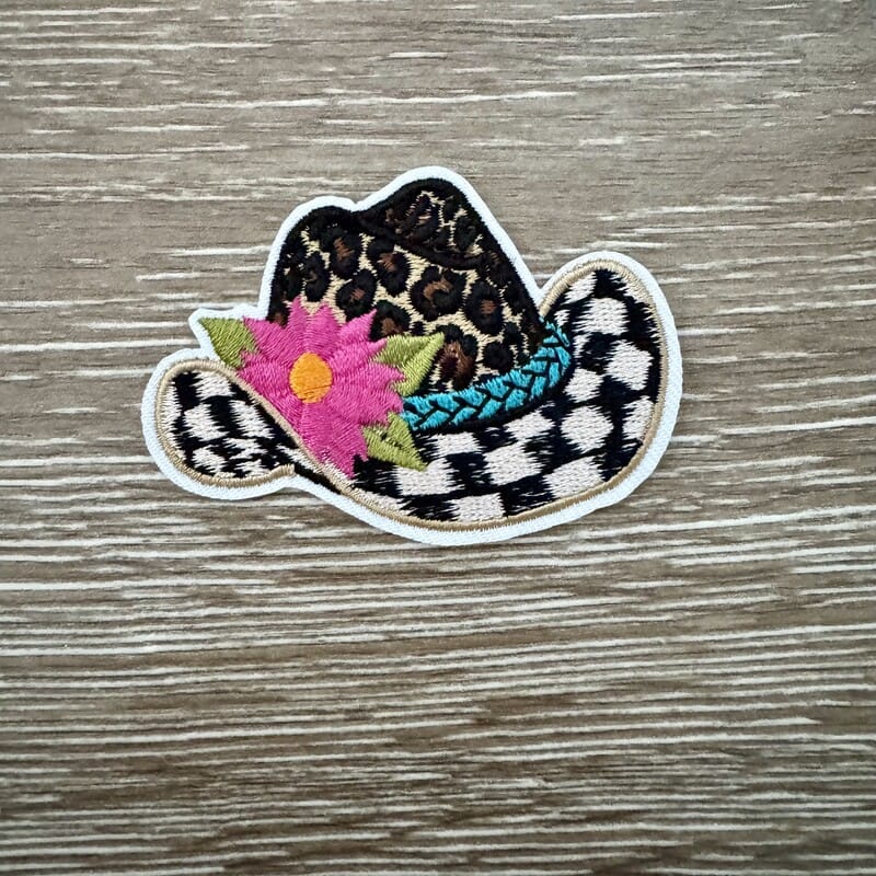 Checkered leopard print cowgirl hat iron-on patch with a pop of floral color for western trucker hats by On A Whim Hats