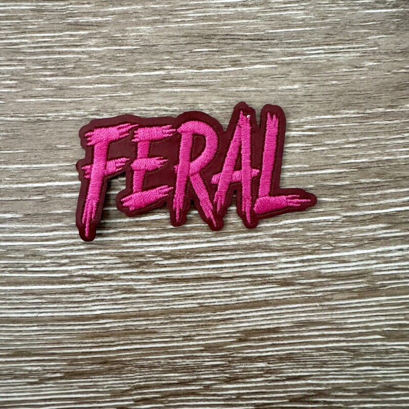 On A Whim Hats Feral Maroon Brush Script Iron-On Patch