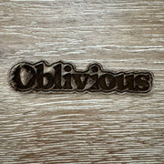 On A Whim Hats Oblivious Wood-Tone Iron-On Patch