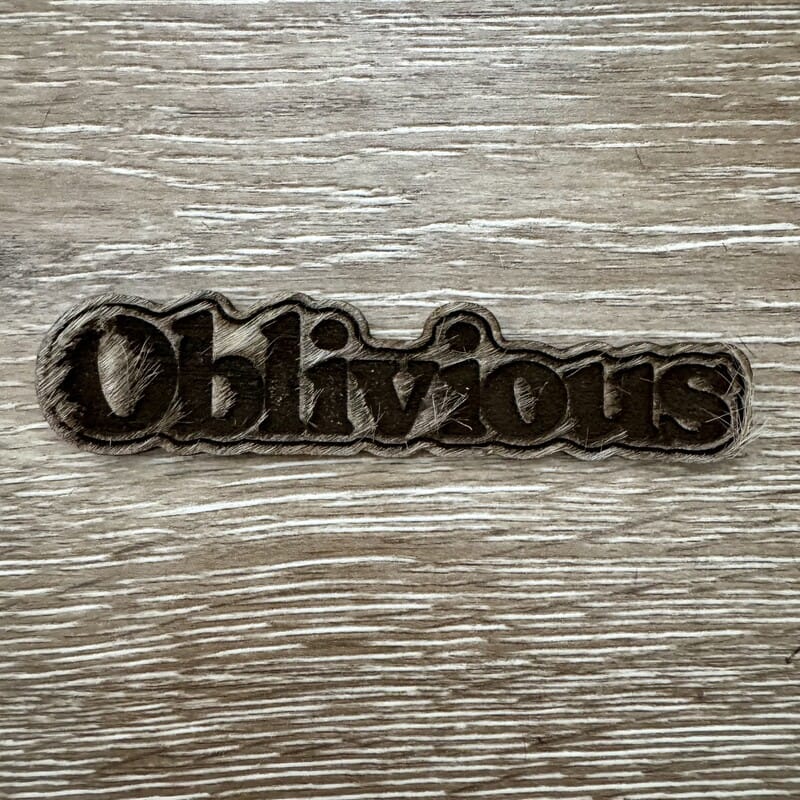 On A Whim Hats Oblivious Wood-Tone Iron-On Patch