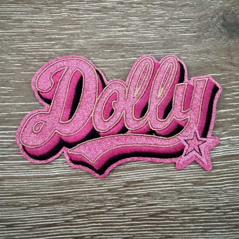 Retro Glam Dolly glitter cursive name iron-on patch with a sparkly shooting star accent for hats by On A Whim Hats