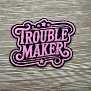 On A Whim Hats Trouble Maker Ornate Script Iron-On Patch
