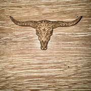 Engraved longhorn skull scrollwork genuine cowhide iron-on patch with wide horns on a natural tan base by On A Whim Hats