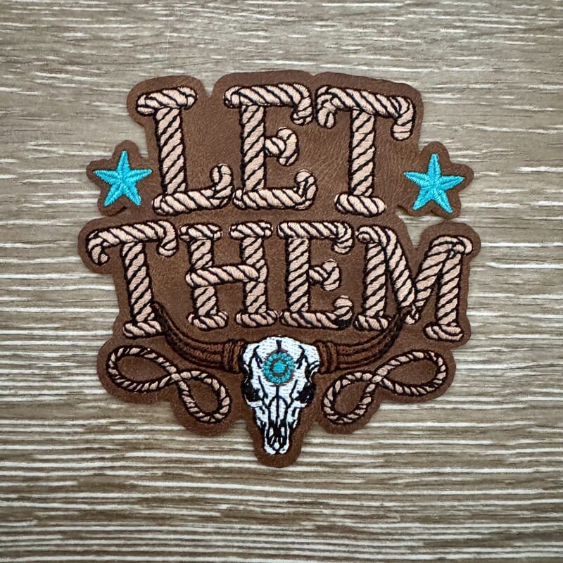 Let Them leather iron-on patch with rope script lettering, turquoise stars and steer skull on tan
