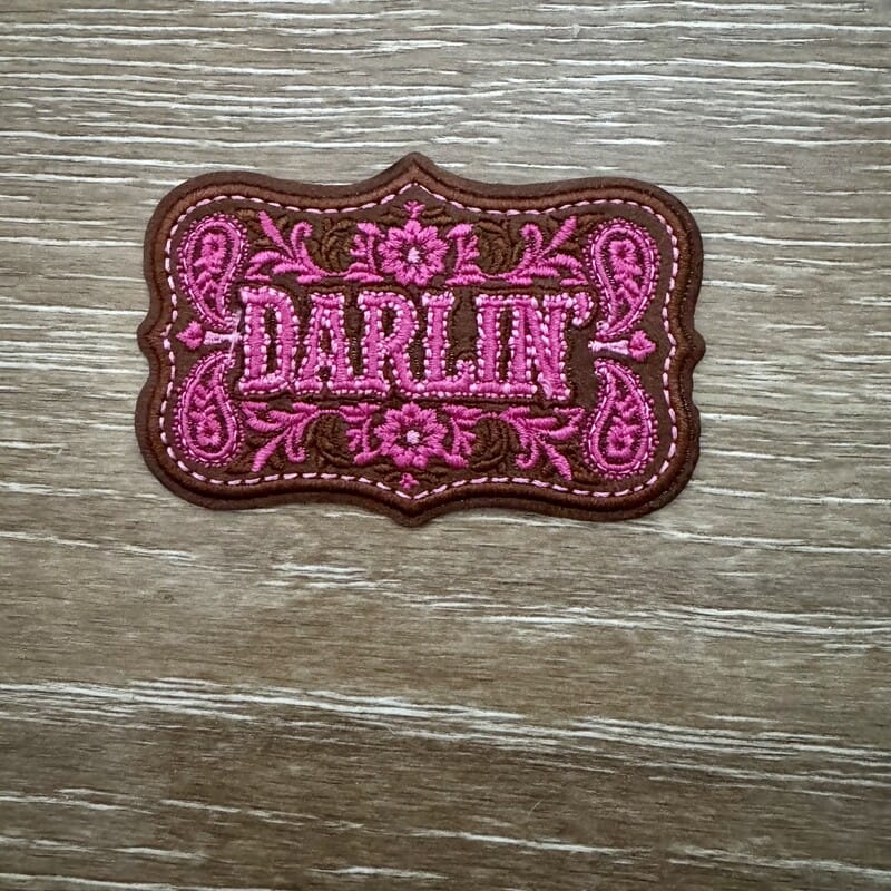 Pink paisley leather iron-on patch with Darlin' script for western trucker hats