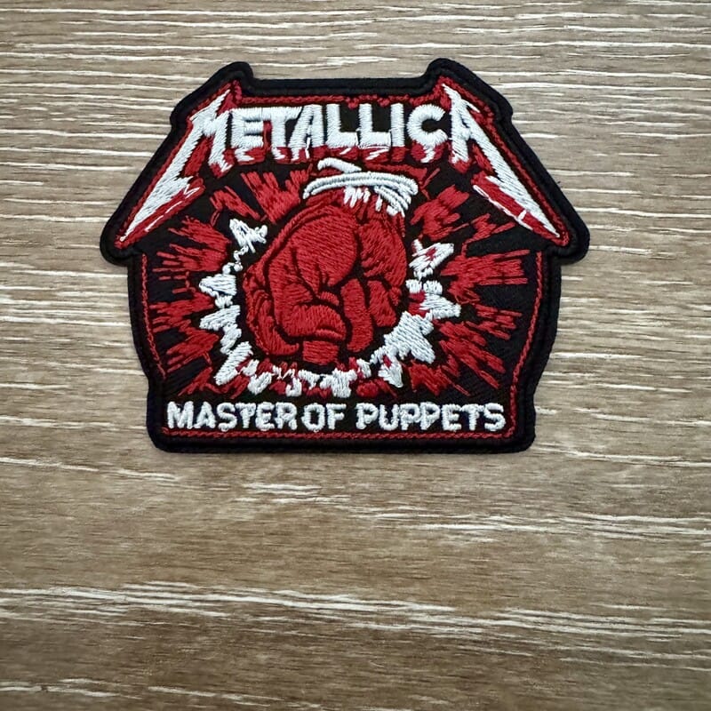 Puppet Hand Flames iron-on patch with skeletal hand and strings