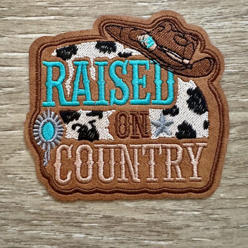On A Whim Hats Raised On Country Cowhide Iron-On Patch