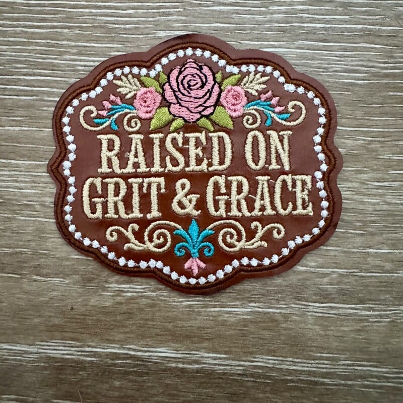Raised on Grit and Grace scalloped badge iron-on patch with roses