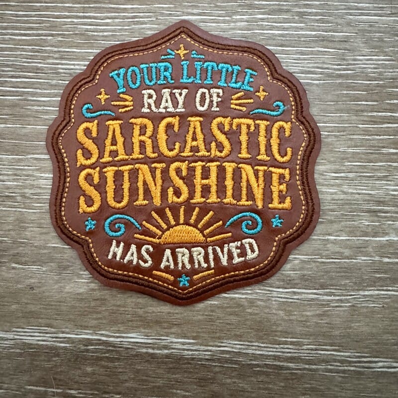 Ray of Sarcastic Sunshine badge iron-on patch with yellow sun