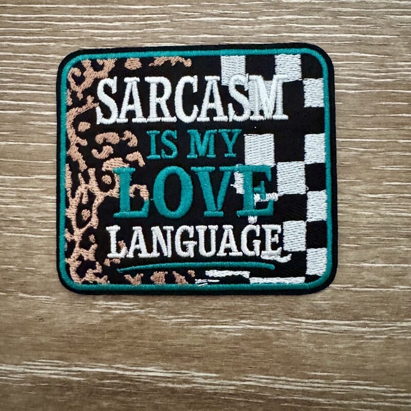Sarcasm Is My Love Language iron-on patch on leopard checkered background