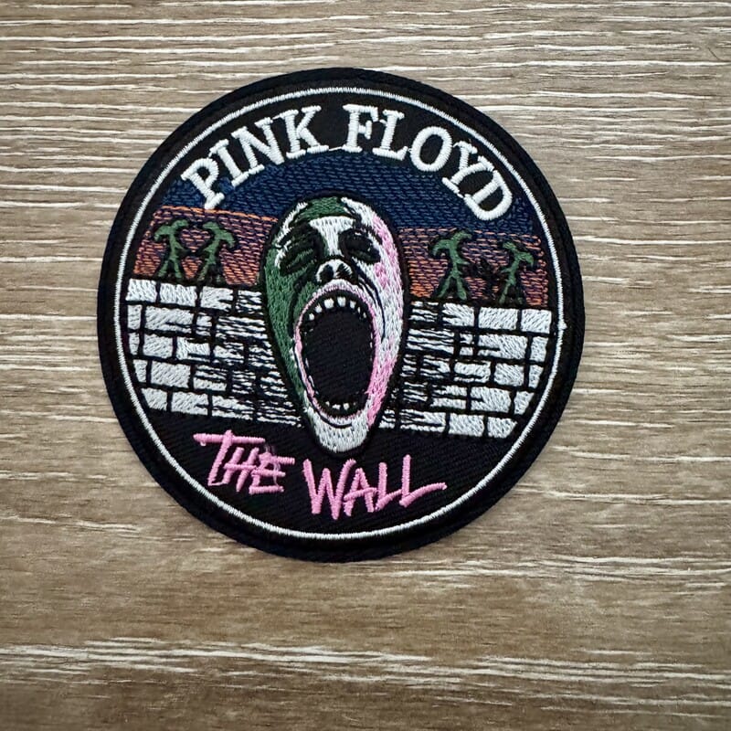 Screaming Face Brick Wall round iron-on patch with palm trees