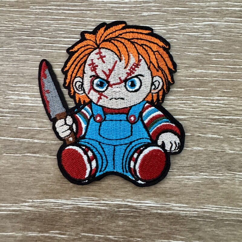 On A Whim Hats Spooky Killer Doll with Knife Iron-On Patch