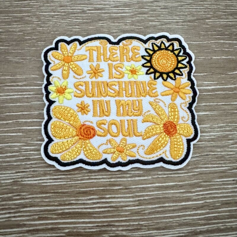 Sunshine In My Soul iron-on patch with golden sunflowers, smiling sun and swirling script