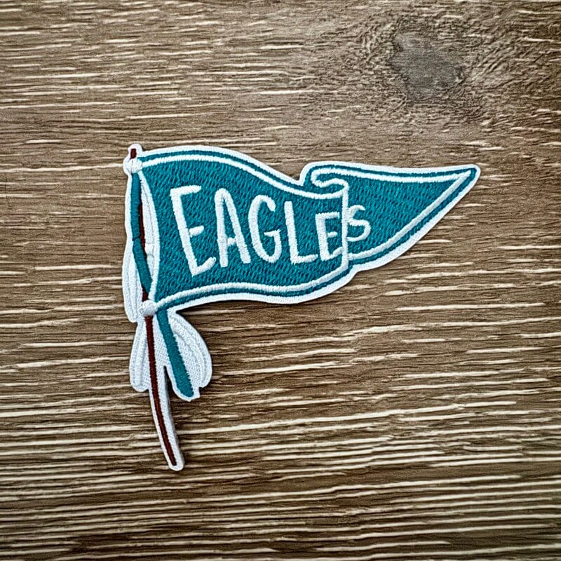 Green and white retro pennant flag iron-on patch with tassels by On A Whim Hats