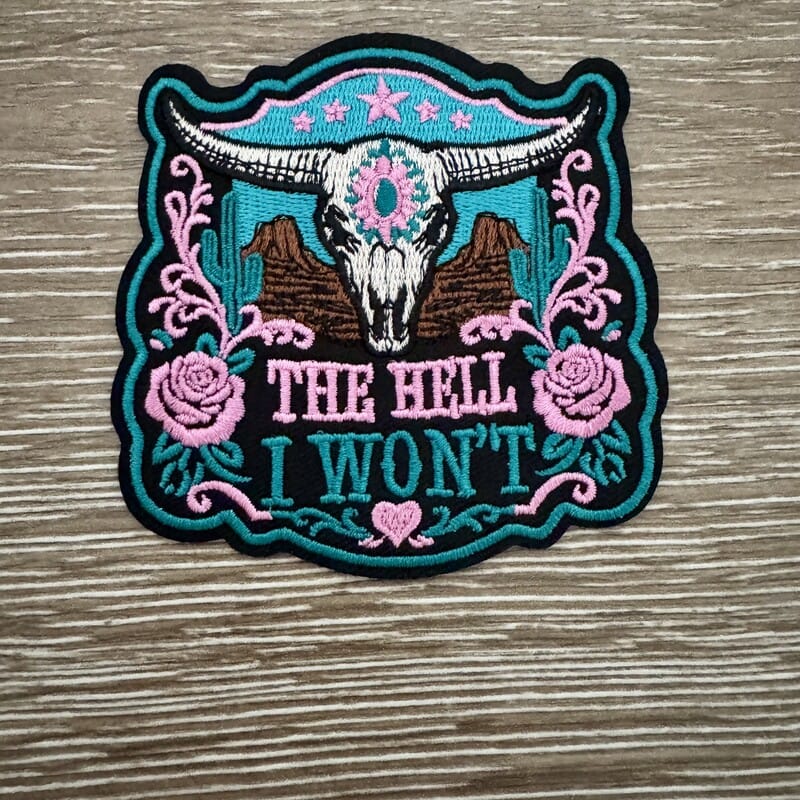 The Hell I Won't western iron-on patch with longhorn skull, teal cactus scrollwork and pink roses
