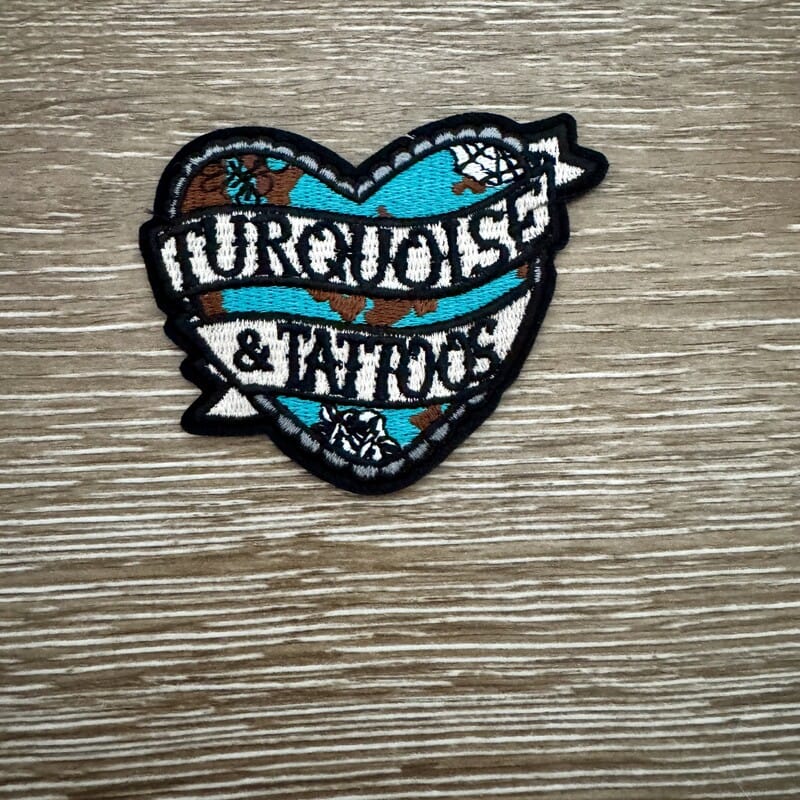 Turquoise and Tattoos tattoo-style heart iron-on patch with arrow and vintage banner
