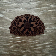 Western sunflower laser-engraved leather-look iron-on patch in dark brown on tan with floral scrollwork by On A Whim Hats