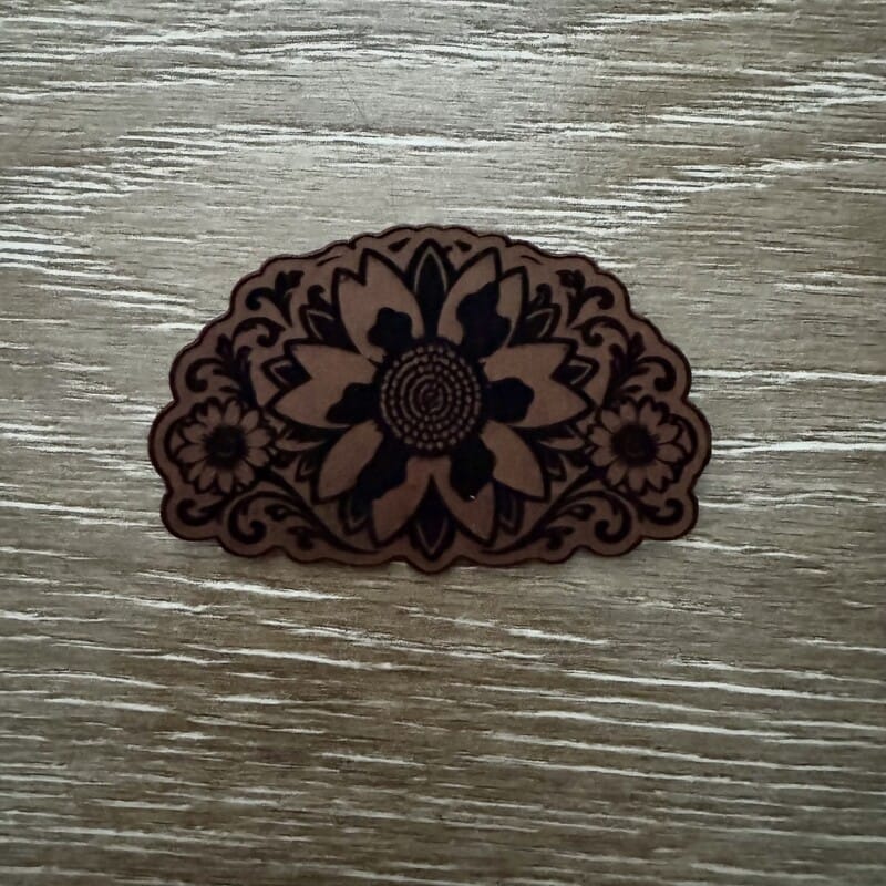 Western sunflower laser-engraved leather-look iron-on patch in dark brown on tan with floral scrollwork by On A Whim Hats