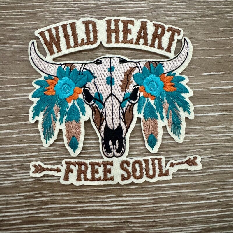 Wild Heart Free Soul iron-on patch with beaded steer skull, turquoise flowers and feathers