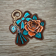 On A Whim Hats Rose Bow Tassel Keychain