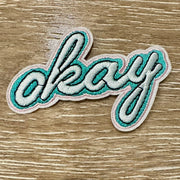 On A Whim Hats Okay Embroidered Iron-On Patch