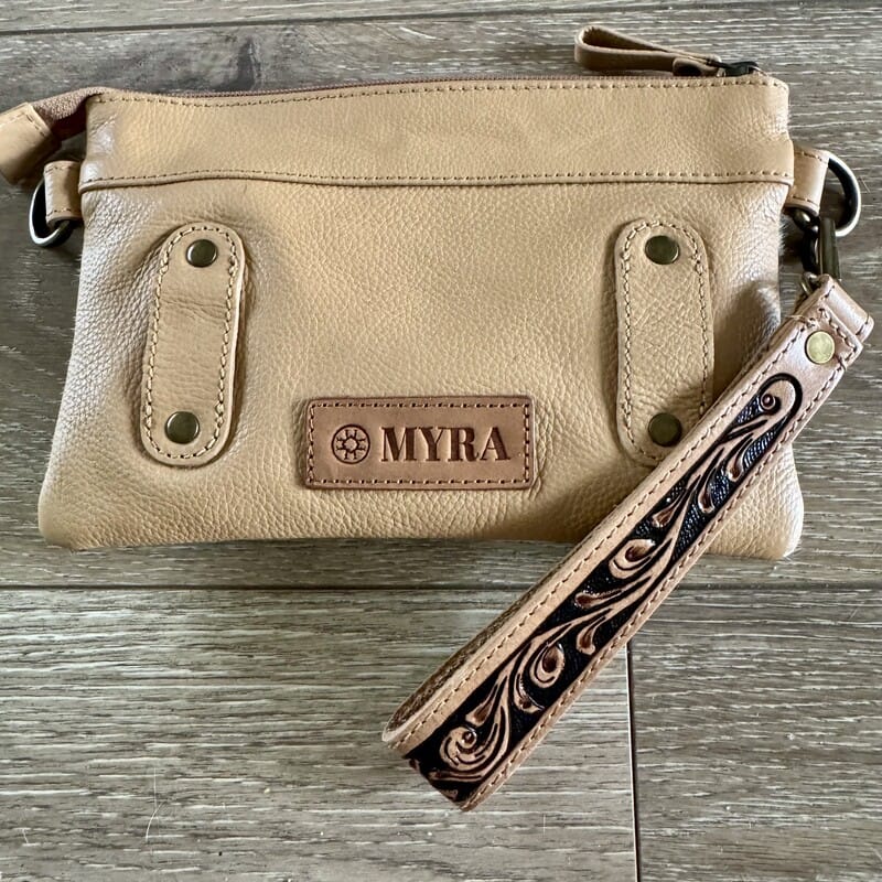 Rodeo cowhide Western handbag with leather trim and adjustable strap, worn crossbody or belt bag